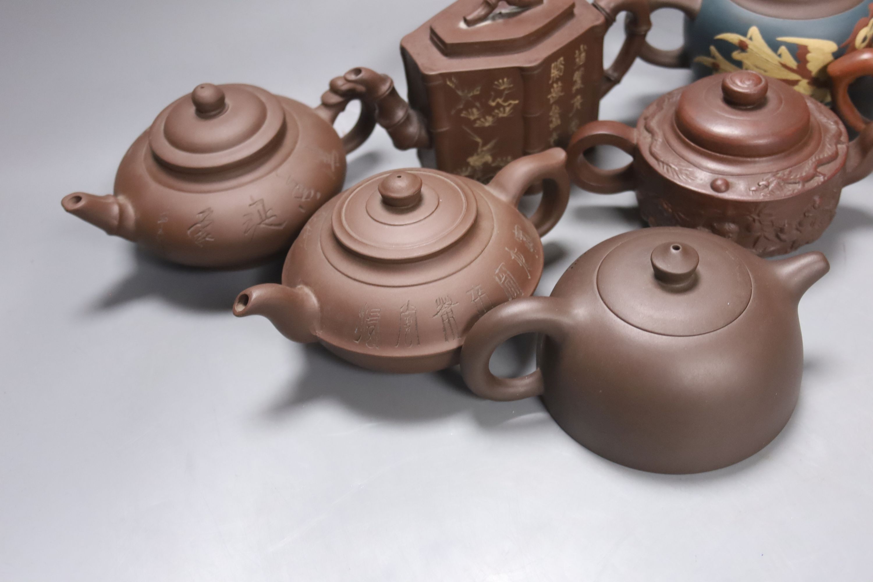 Seven Chinese Yixing teapots, tallest 11 cms high.